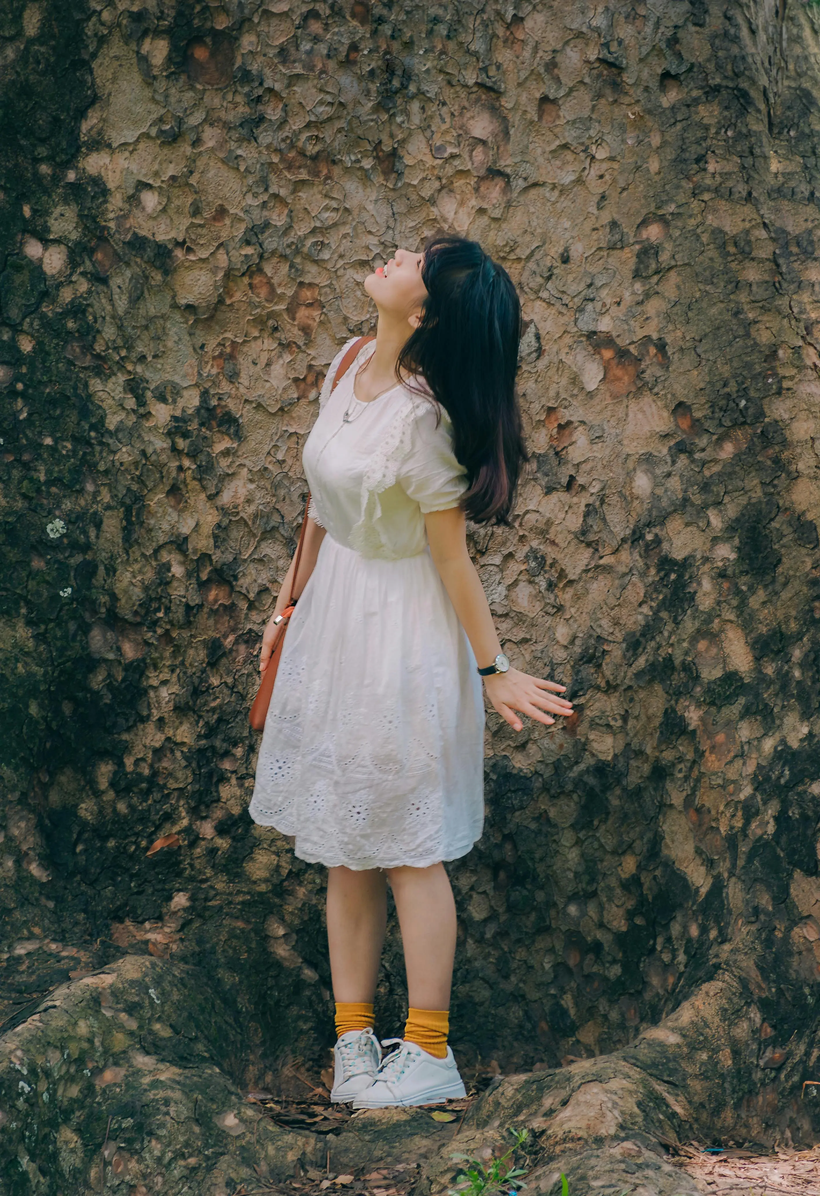 Lace everything trend summer 2026 — woman in white lace eyelet dress outdoor